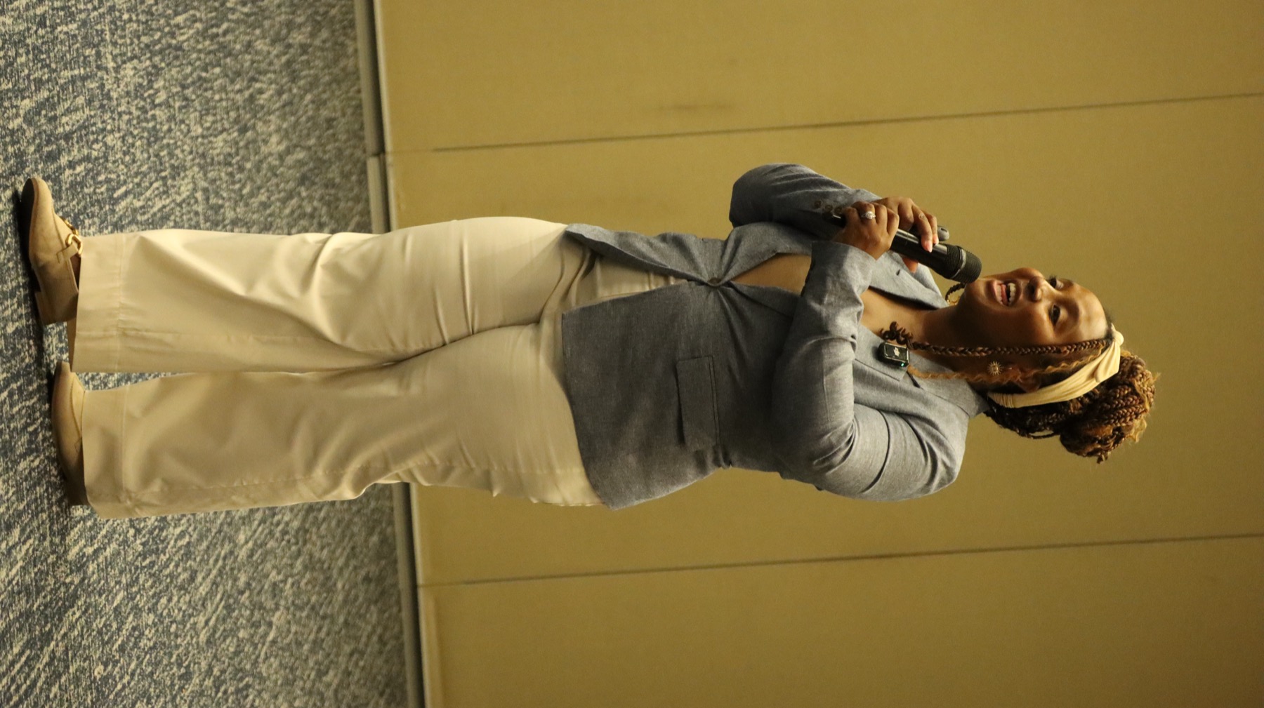 Original event photograph of Shatrasha smiling while speaking